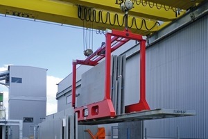  The load beam is fitted with electrically driven arms that can be extended and grab the inloader rack on its sides 