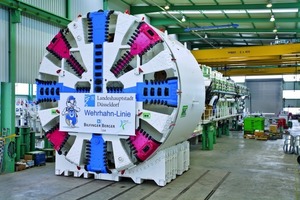  Fig. 10 A masterpiece of tunneling technology: The driving machine, weighing over 1300 tons and 65m long in the factory hall of Herrenknecht awaiting transport to the construction site. 