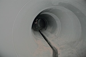  Fig. 4 and 5 A widely branching sewer network had to be newly constructed and/or rerouted, in many cases along the building fronts. The pictures give an impression of the “underworld” with deep manholes and partly pronouncedly curved pipe routings, all of which made of high-quality  reinforced-concrete system elements. 