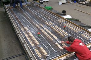  Displacement bodies and TBE ducts embedded at the factory in the precast bottom sandwich layer of a Ceiltec A floor 