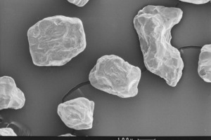  Fig. 1 SEM scans of various 0.125/0.5 mm sands (left and center: various fluvial sands; right: crushed sand). 