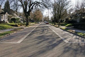  Fig. 2 The permeable pavers receive runoff into an open-grade aggregate base, or “drainage blanket,” that extends under the asphalt across the entire street. This boosts water storage and infiltration capacity.  