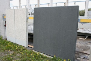  Several 2 × 2 m sample slabs in various colors and textures are on display outdoors for visitors 