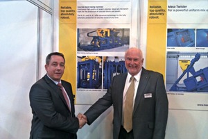  With a symbolic handshake, Heaton (right) and Cheetham sealed the sale of Beton Machinery Sales Limited at the UK Concrete Show in Birmingham 