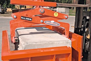  In the next step, a concrete block clamp grabs the cured block ... 