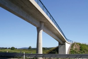  Fig. 6 Example of a precast concrete bridge: pedestrian and bicycle overpass near Möhrendorf (Germany), pre-stressed precast structural elements with a single span of 30 m and a clamped mid-span column.  