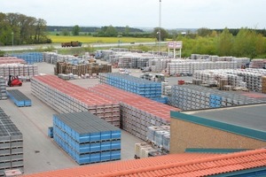  Fig. 1 On the rear side of the plant constructed in 1998, the outdoor storage area is located immediately adjacent to the highway to Berlin. 