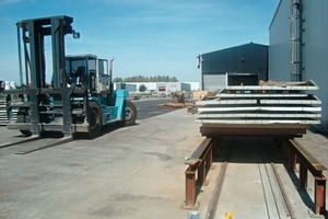  Fig. 1 Shipping station at ­Rector Lesage in Weyersheim, France: Preassembled precast parts await removal by stacker on the two I-beam lanes. 