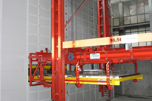  After concrete pouring, the storage and retrieval unit places the production pallet in one of the 53 slots of the enclosed curing chamber 