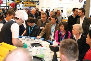  Fig. 2 Equipped with headsets, visitors embarked on their guided tours at the Hebau booth after a welcome drink. 