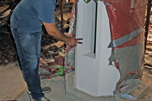  Project Manager, ­Manyl Riad Mekdade, inspects the surface quality of the spun concrete columns on site 