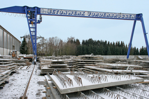  Transport of the hardened elements by means of a gantry crane for intermediate storage at the factory premises 