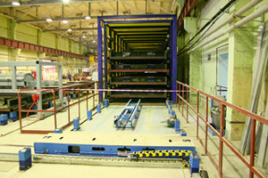  Fig. 3 Fully automated charging of the curing chamber with six passing through levels for maximum 66 pallets. 