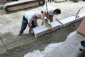  The mechanical grab is attached with a chain to an excavator 