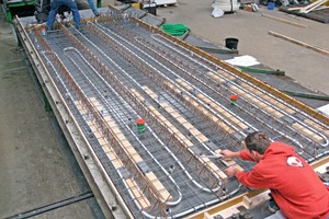  Displacers and HVACR conduits are embedded in the bottom sandwich shell of a Celtic A floor at the factory  