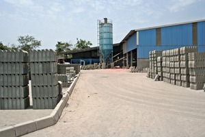  View of the storage yard with the production building and Simem mixing plant in the background 