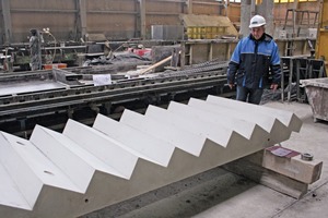  Production manager Stanisław Kula checks the quality of finished reinforced-concrete stair elements 