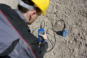  Fig. 1 Checking moisture of sand delivery. 