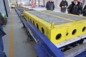  Rigid steel frames with four mold troughs each have been combined to form a sleeper block mold 