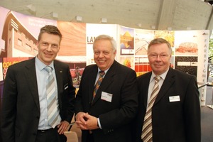  Dr. Thieme, Ch. Ende, Harold Scholz GmbH, and G. Büchner, LanXess We, LanXess, are the world leader in the iron oxide market, and I [Mr. Büchner] have been in this business for 37 years. For more than 30 years already, I have attended the BetonTage congress in Ulm. This year’s event is the last one for me as I am going to retire soon. As the partner of LanXess, or previously Bayer, in the iron oxide business, Harold Scholz has also been at the Ulm BetonTage congress for decades. As a matter of course, we also listen to the presentations if the panels include interesting topics in the fields of concrete blocks and pavers and gardening and landscaping, or presentations of general interest, such as on the market situation, or contributions by architects regarding projects in which our companies had been involved, such as the Holocaust Memorial. We’ve also already delivered some presentations ourselves. This year, the mood is very relaxed, and congress attendees are rather positive about the industry. The 54th BetonTage congress can again be considered an information platform. What is important to us is to take care of our existing customers, and sometimes even new contacts are established. And if you ask us where we see the position of the BetonTage congress: it ranks second, after the Bauma trade show.  