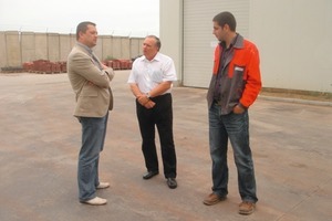  Fig. 1  Left to right: H. Radulov, Technocim Vice President, and H. Iliev, project manager, talking to H. Bendurski, the Hess representative for Bulgaria.  