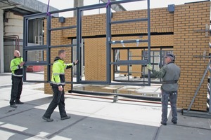  Workers of the Veldhoven factory are installing the window frames 