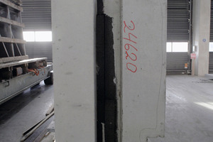  Side view of a precast element after formwork stripping. The black foam glass insulation appears prominently in the middle 