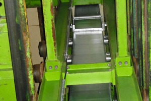  Four branch ducts are running among the shelves from the roof to the floor of the curing chamber, carrying the heated air into the chamber  