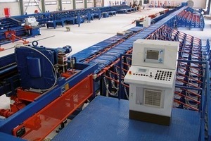  A bending shop in Dubai equipped with a stationary Cadormatic 500 reinforcing steel cutting system including collection boxes, transverse conveyor and automatic dual bending unit. 