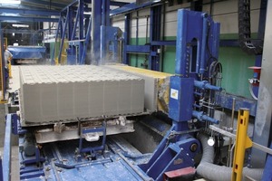  Fig. 3 On removal the bed waste is being sucked onto the autoclave pallet. 