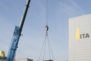  A mobile crane lifts the five shells carefully onto the substructure using a cross-like supporting structure made of steel 