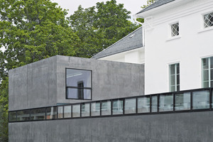  The old existing building was rehabilitated and supplemented on the rear by a new annex of architectural colored black Liapor lightweight concrete  
