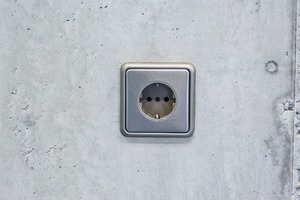  Ready-made socket installed on an architectural concrete wall  