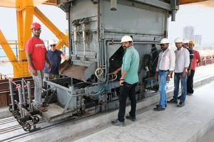  Roy Harrison (2nd left), General Manager of MAADcrete, with some members of his team at the Spancrete production system 
