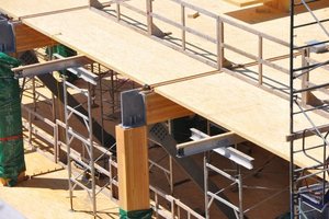  → 1 Wooden panels supported on glued laminated timber beams with inserted WCC shear connectors. After concrete pouring, the timber-concrete composite beams form the primary floor structure whereas the timber-concrete composite floors positioned transversely to the main direction of support generate the secondary floor structure  