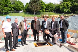  Fig. 3 Laying of the foundation stone: Georg Böck (building company Böck), Dr. Angelo Schmandra (BHS), Dr. Christof Kemmann (BHS), district administrator Gebhard Kaiser, Mayor Hubert Buhl, municipal architect Lutz-Holger Behre, shop chairman Engelbert Bechteler (from the left), architect Martin Unzeitig (kneeling). 