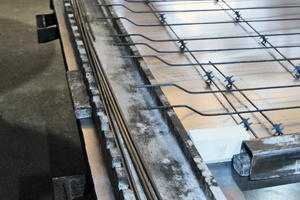  The formed reinforcing bars on the shuttering table ...  