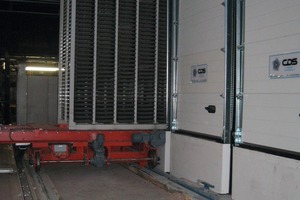  Fig. 1 Freshly produced tiles being loaded into the CDS curing system. 