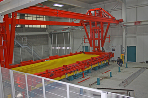  The turning station places the hardened reinforced concrete shell on top of the second shell on the production pallet  
