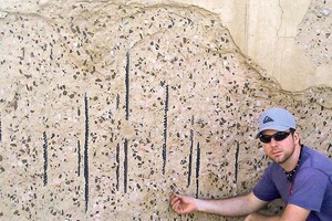  PhD candidate Ronald Richter inspects a concrete slab previously exposed to excessive heat 