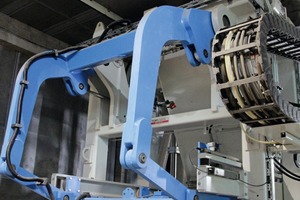  The new Multimat RH 2000 MVA block-­making machine in the third circulation system. The drawing sheet for production of color mix products is clearly visible at the top  